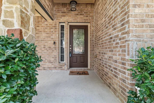 a view of front door of house with stairs