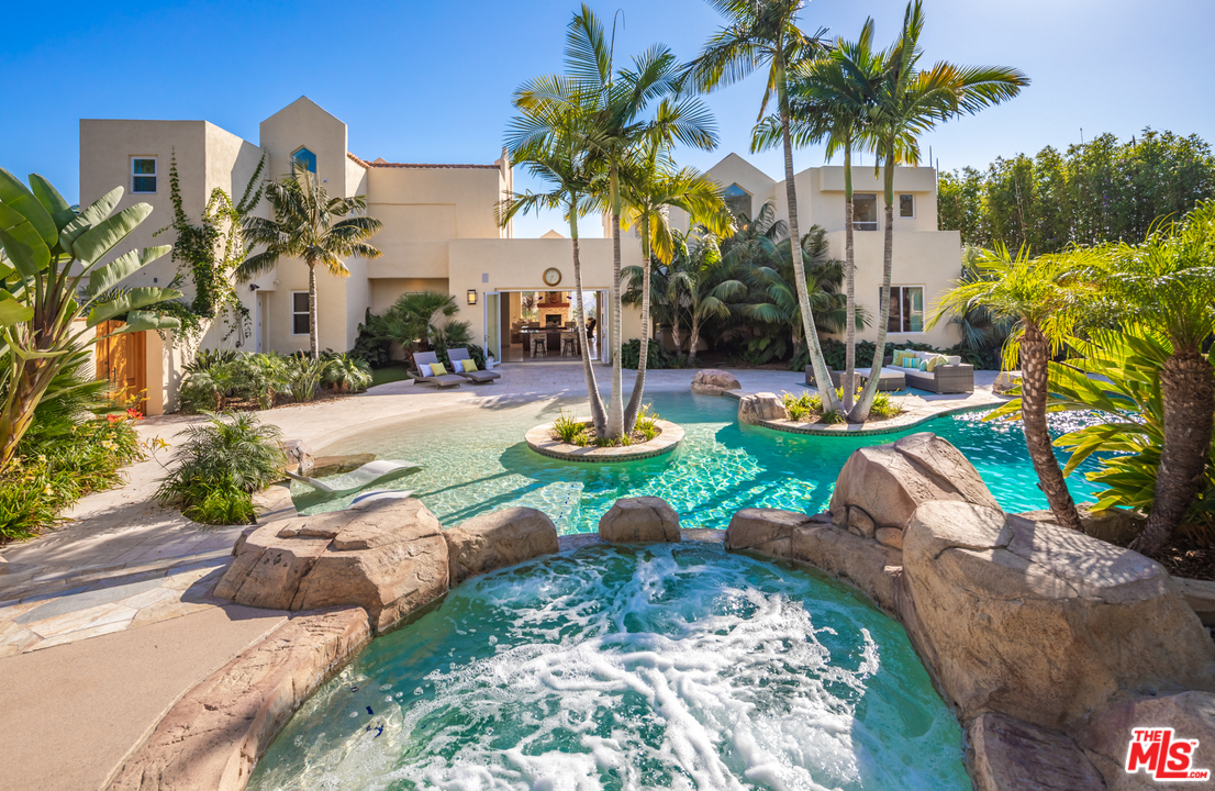1264 Rancho Encinitas Drive Encinitas, CA 92024 - Photo 2 of 25 a view of a garden with palm trees