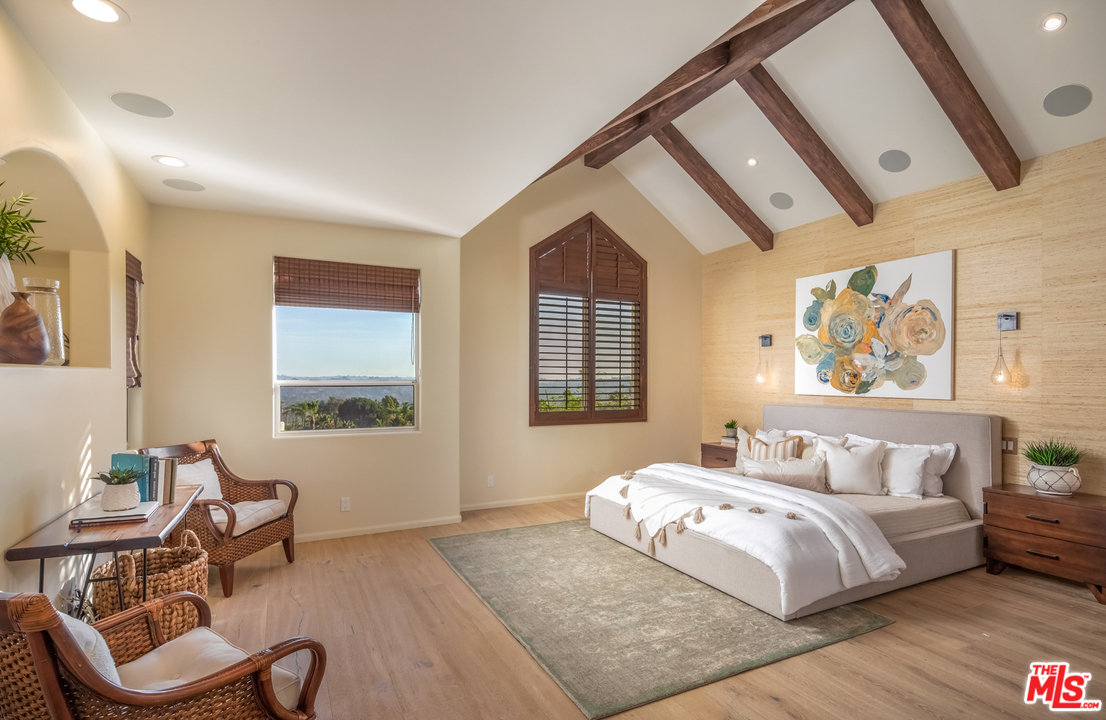 1264 Rancho Encinitas Drive Encinitas, CA 92024 - Photo 13 of 25 a bedroom with a bed and wooden floor