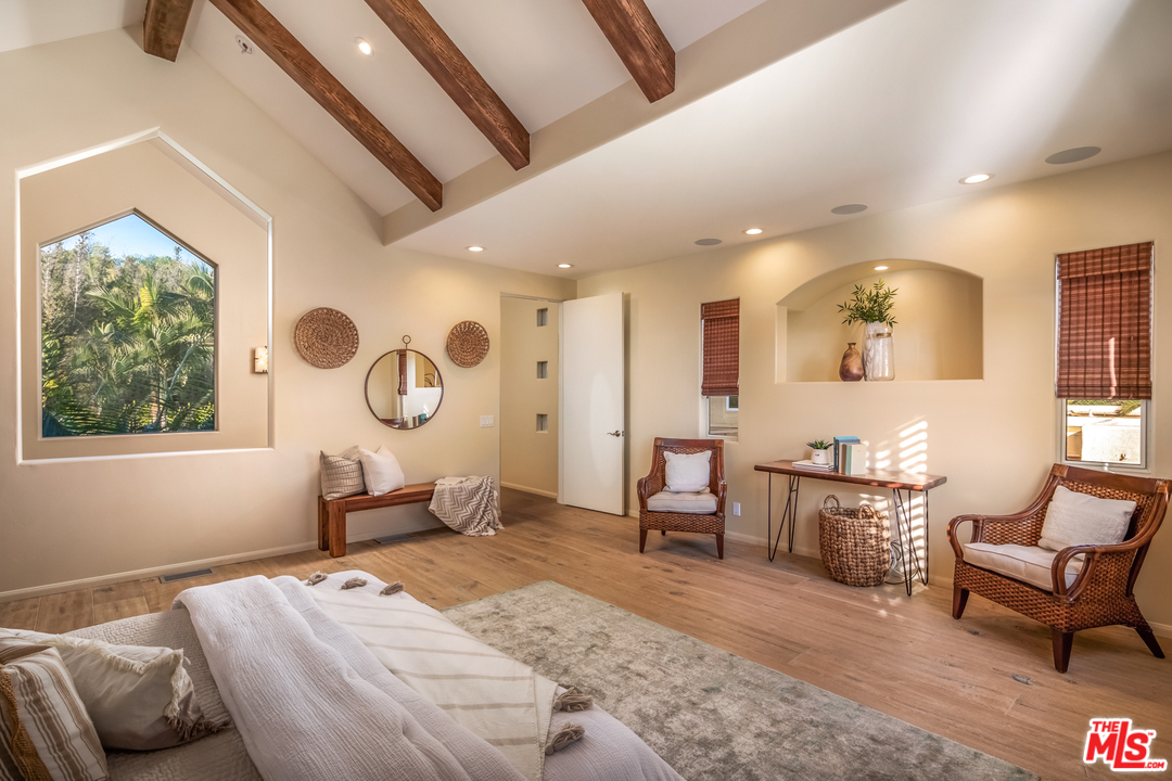 1264 Rancho Encinitas Drive Encinitas, CA 92024 - Photo 14 of 25 a bedroom with a bed a table and chair