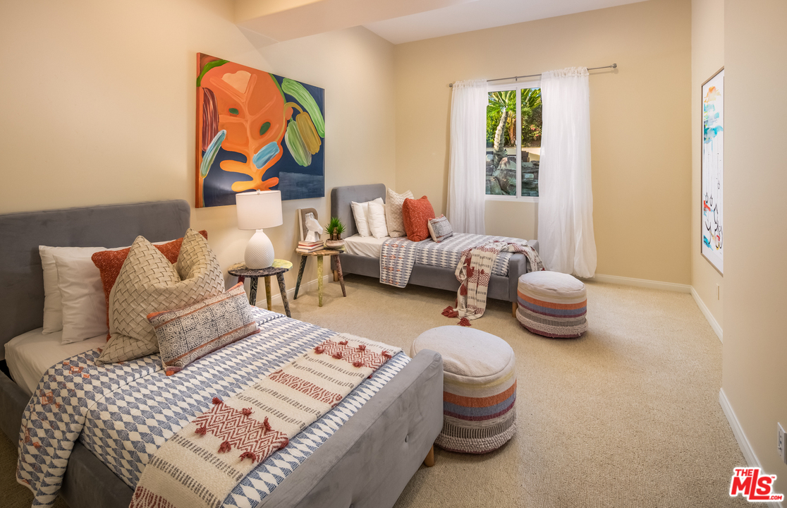 1264 Rancho Encinitas Drive Encinitas, CA 92024 - Photo 16 of 25 a bedroom with bed and a couch