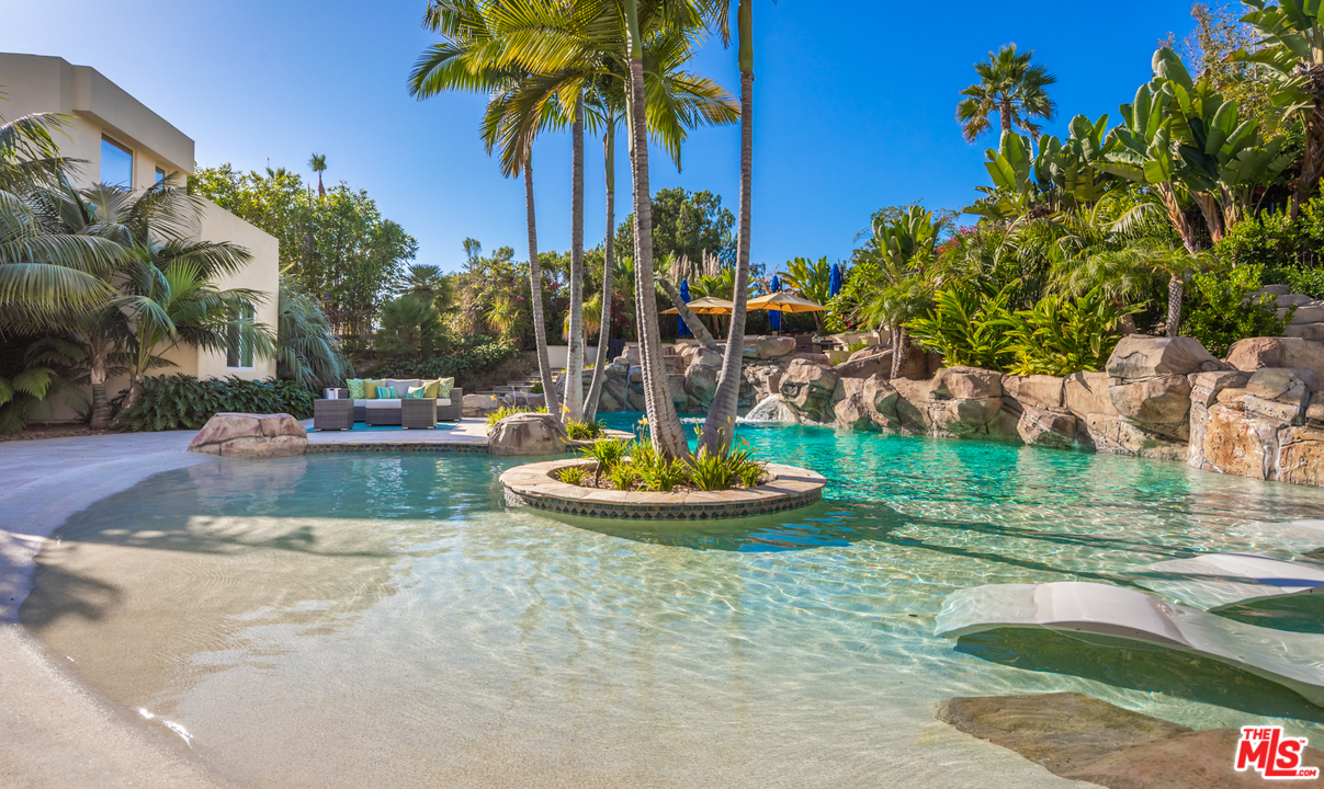 1264 Rancho Encinitas Drive Encinitas, CA 92024 - Photo 18 of 25 a view of a swimming pool with a yard