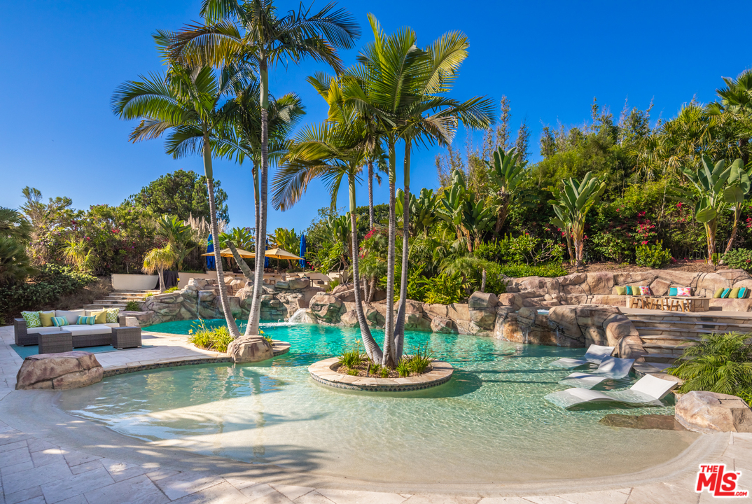 1264 Rancho Encinitas Drive Encinitas, CA 92024 - Photo 19 of 25 a view of a backyard with plants and swimming pool
