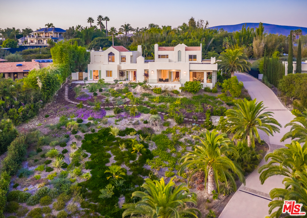 1264 Rancho Encinitas Drive Encinitas, CA 92024 - Photo 3 of 25 a view of a house with a yard and potted plants
