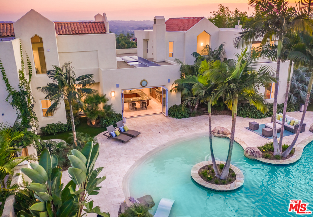 1264 Rancho Encinitas Drive Encinitas, CA 92024 - Photo 21 of 25 a swimming pool with a yard and plants