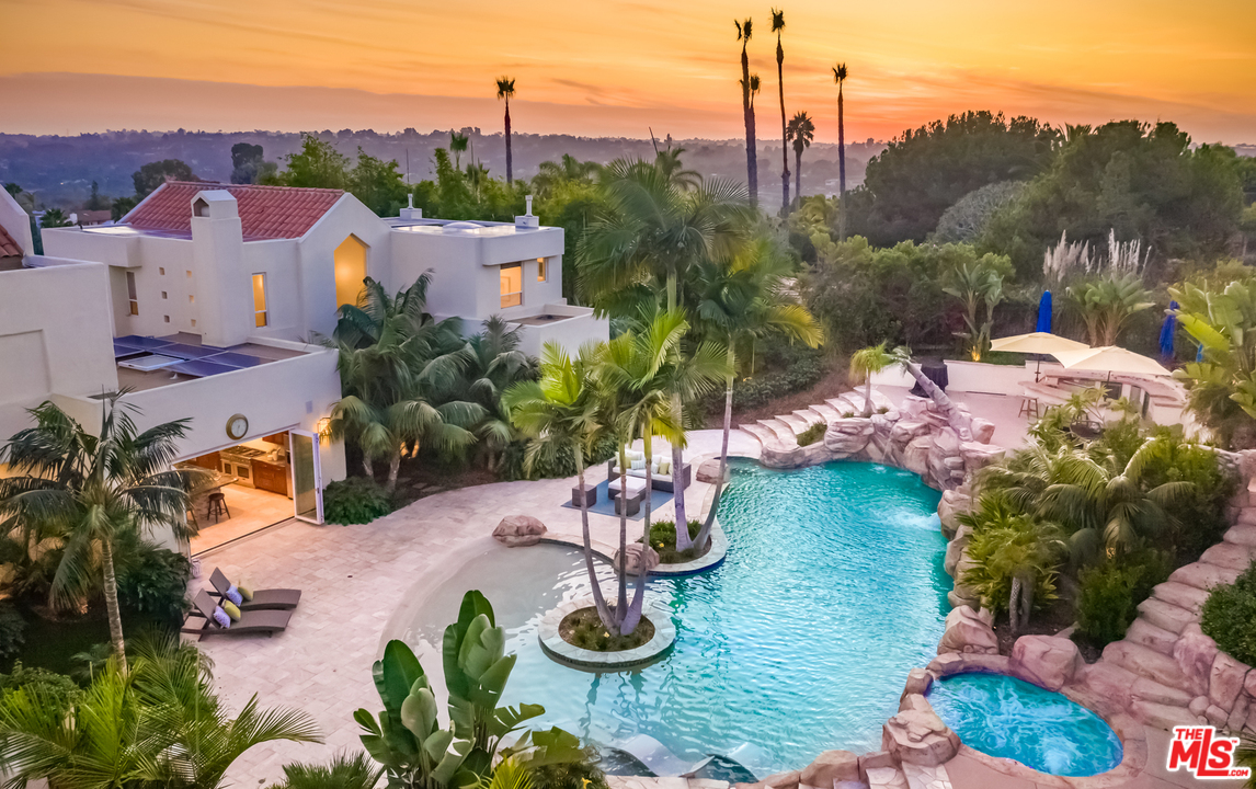 1264 Rancho Encinitas Drive Encinitas, CA 92024 - Photo 22 of 25 a view of a lake with a house in the background