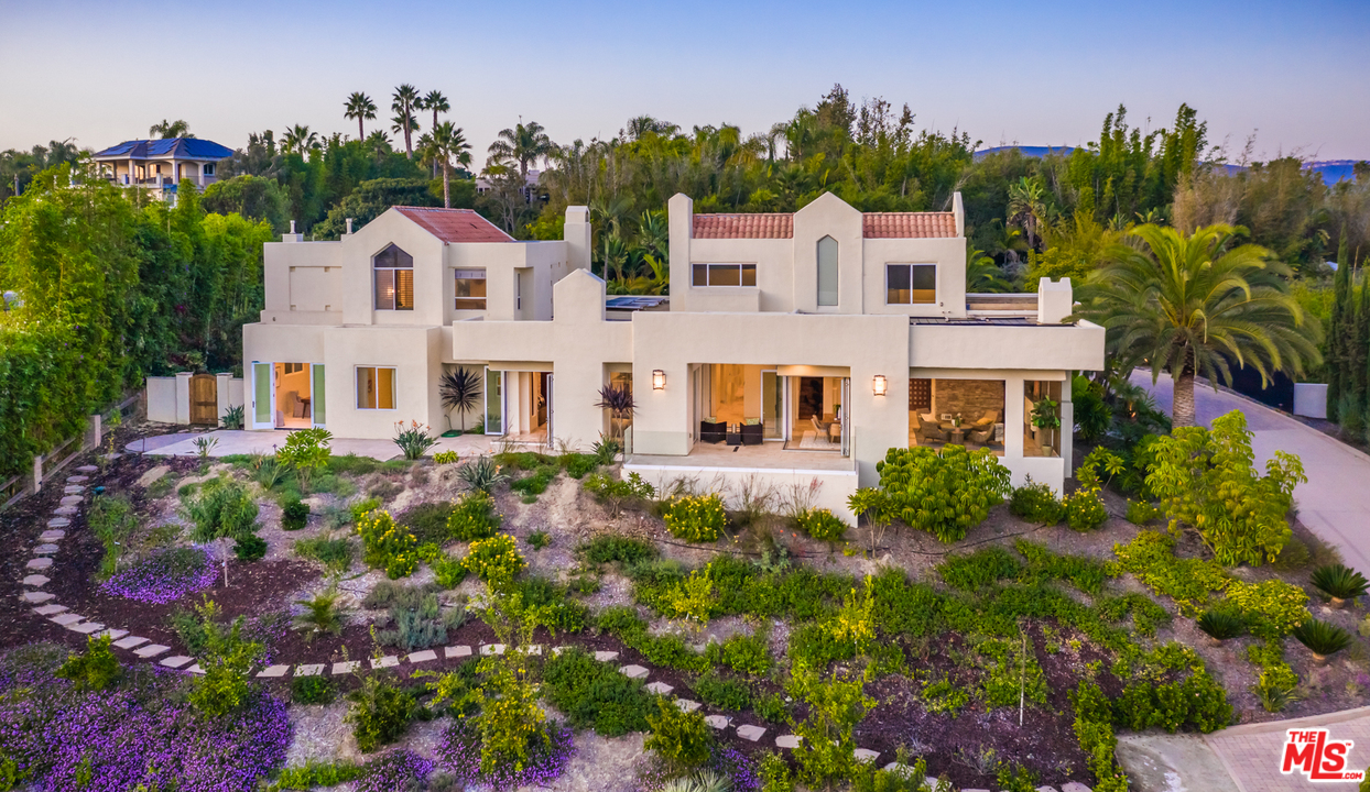 1264 Rancho Encinitas Drive Encinitas, CA 92024 - Photo 4 of 25 a front view of a house with a yard and garden