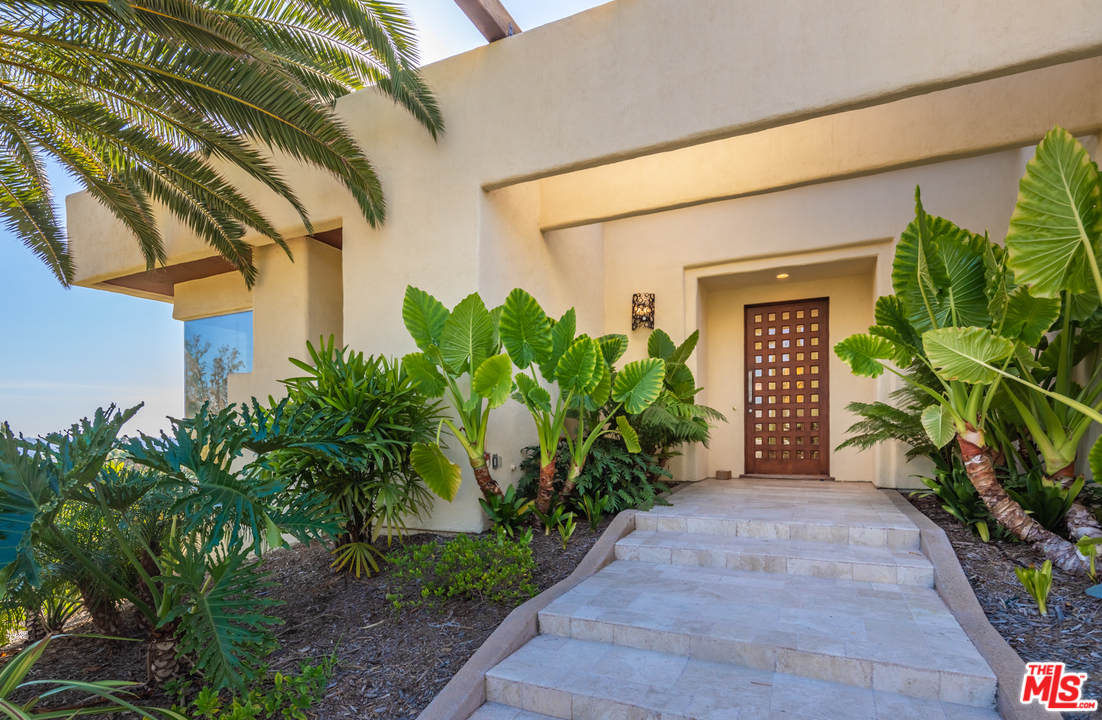 1264 Rancho Encinitas Drive Encinitas, CA 92024 - Photo 5 of 25 a front view of a house with a yard