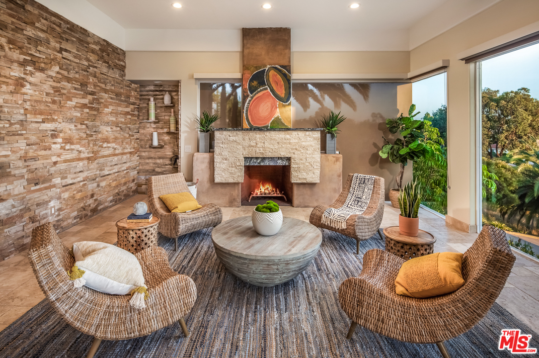 1264 Rancho Encinitas Drive Encinitas, CA 92024 - Photo 9 of 25 a living room with furniture and a fireplace