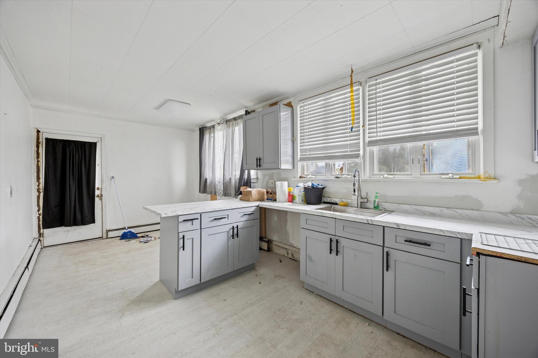 1000 Main Avenue Croydon, PA 19021 - Photo 11 of 25 a kitchen with sink cabinets and wooden floor