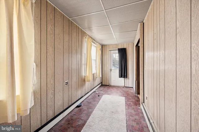 a view of a big room with wooden floor and staircase