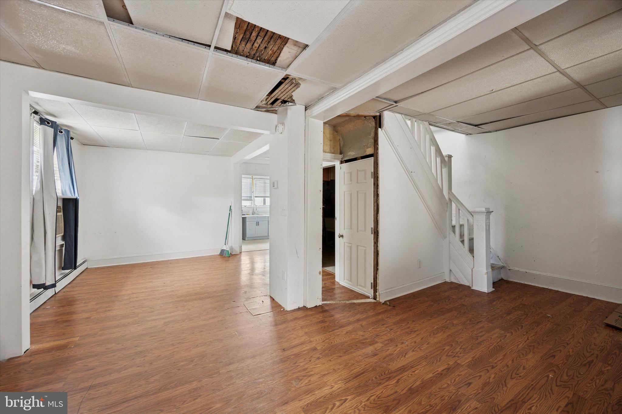 1000 Main Avenue Croydon, PA 19021 - Photo 4 of 25 a view of a big room with wooden floor and staircase