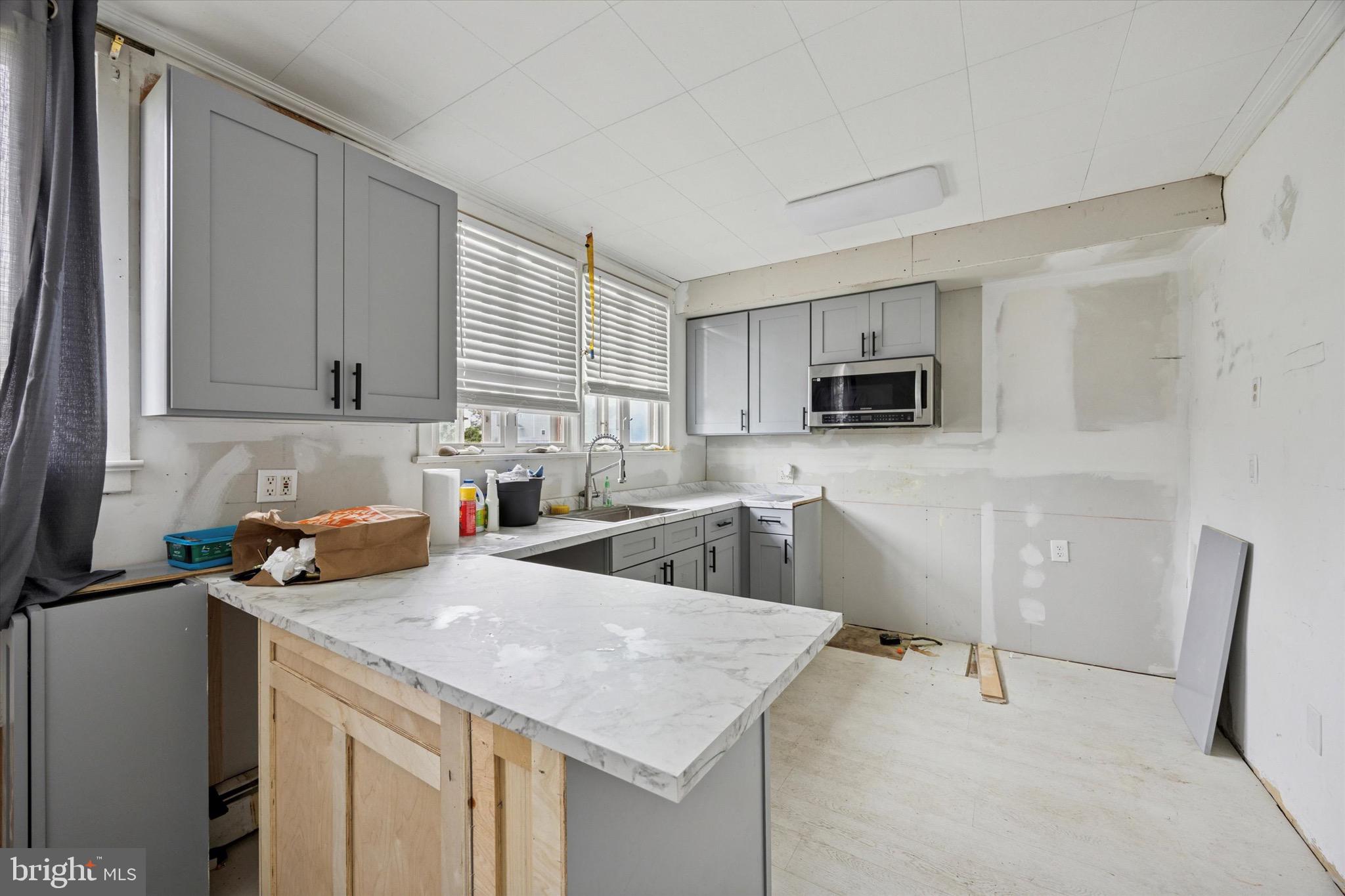 1000 Main Avenue Croydon, PA 19021 - Photo 10 of 25 a kitchen with a sink a stove and cabinets