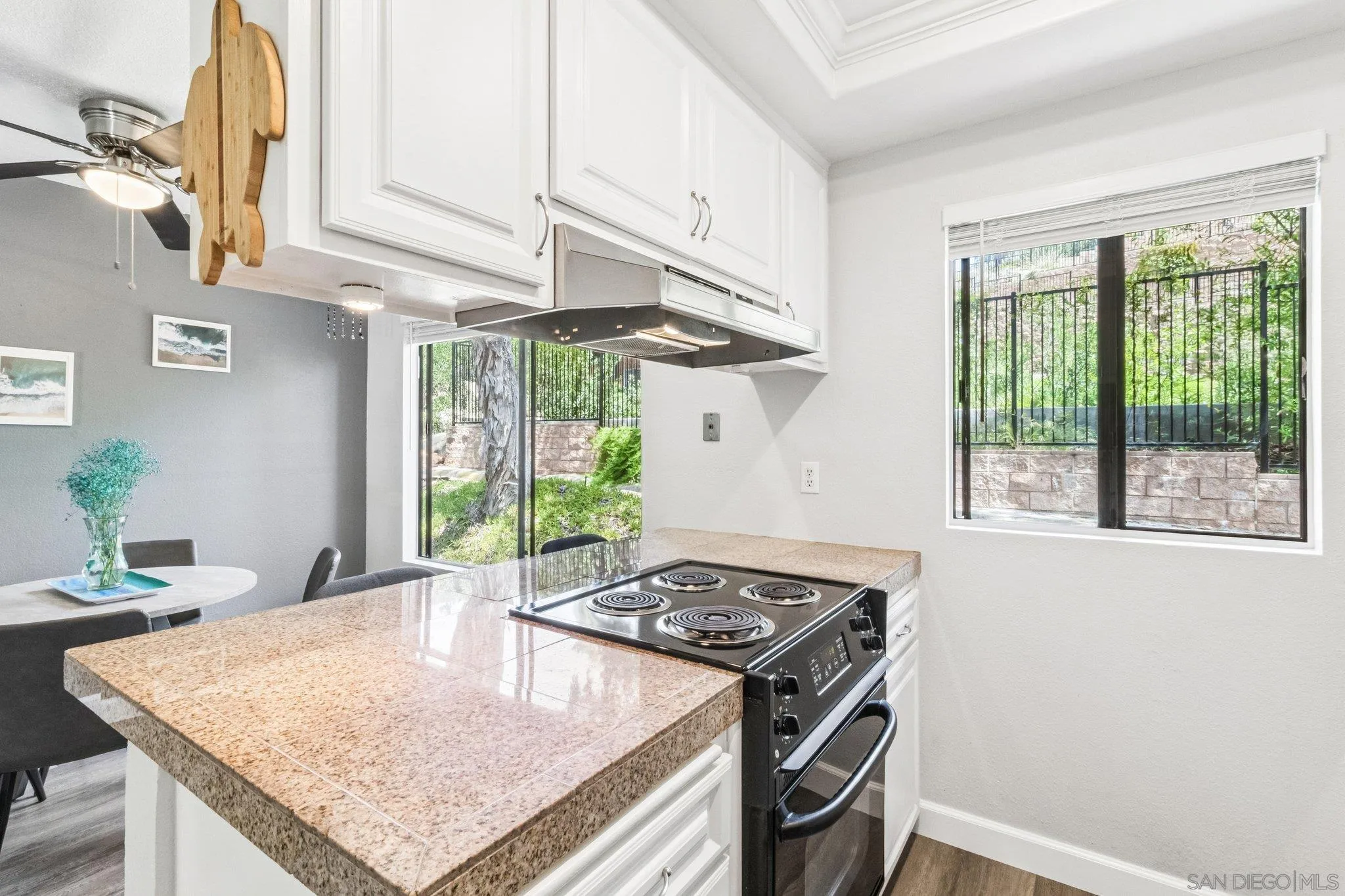 2157 Arnold Way, Unit 624 Alpine, CA 91901 - Photo 14 of 26 a kitchen with stainless steel appliances granite countertop a stove a sink and a refrigerator