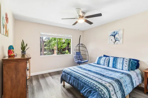 a bedroom with a bed and a window