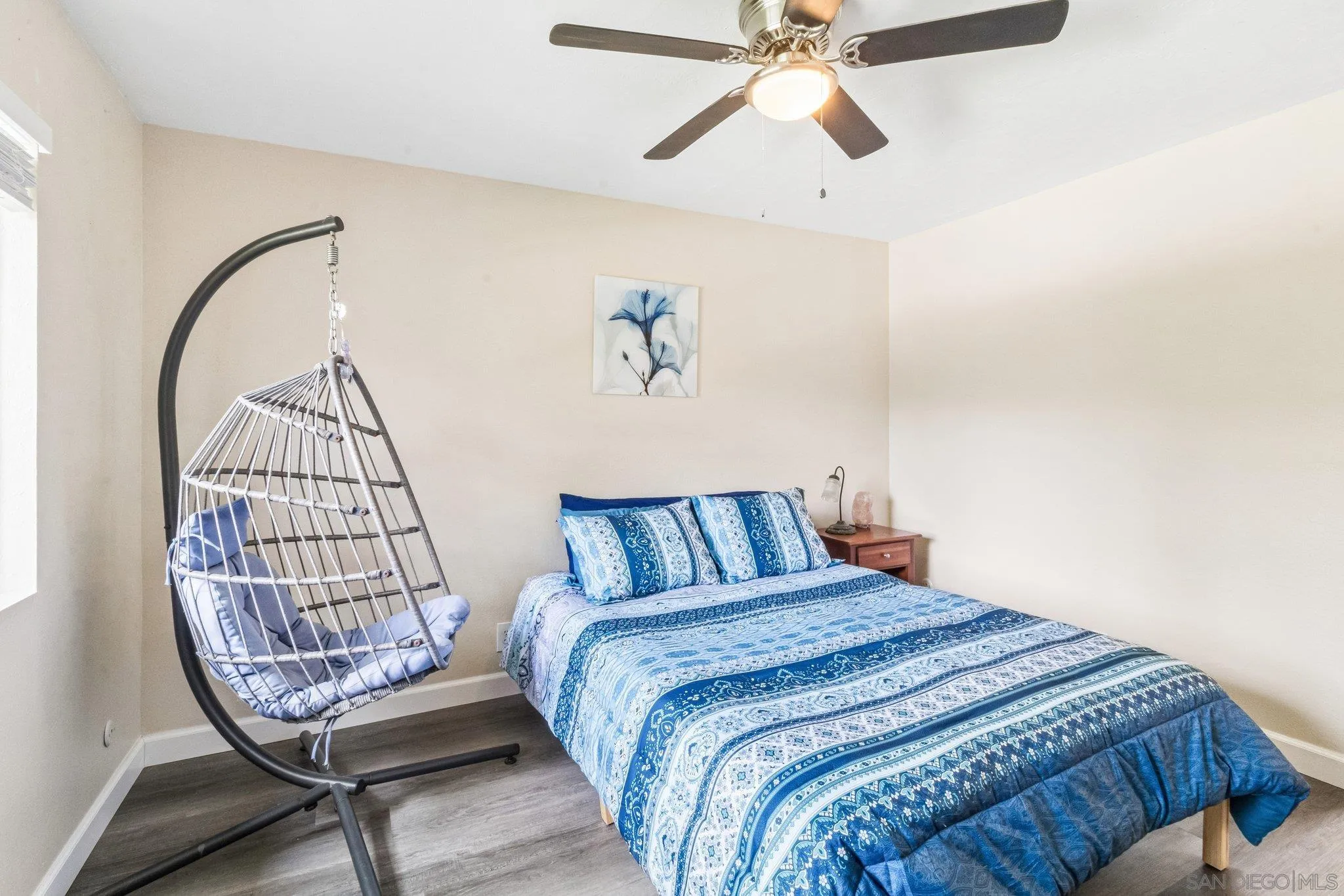 2157 Arnold Way, Unit 624 Alpine, CA 91901 - Photo 17 of 26 a bedroom with a bed a painting on the wall and a window