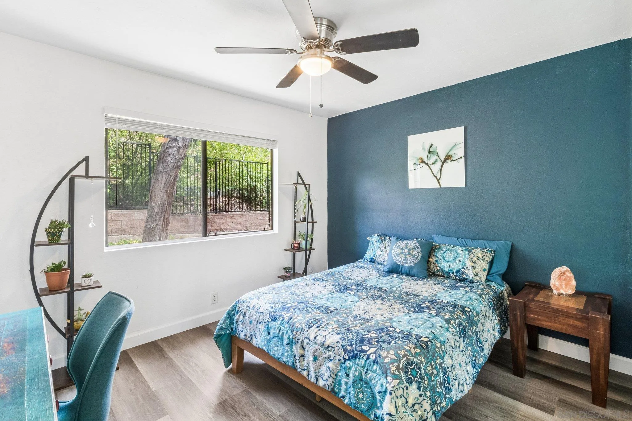 2157 Arnold Way, Unit 624 Alpine, CA 91901 - Photo 22 of 26 a bedroom with a bed and a chandelier
