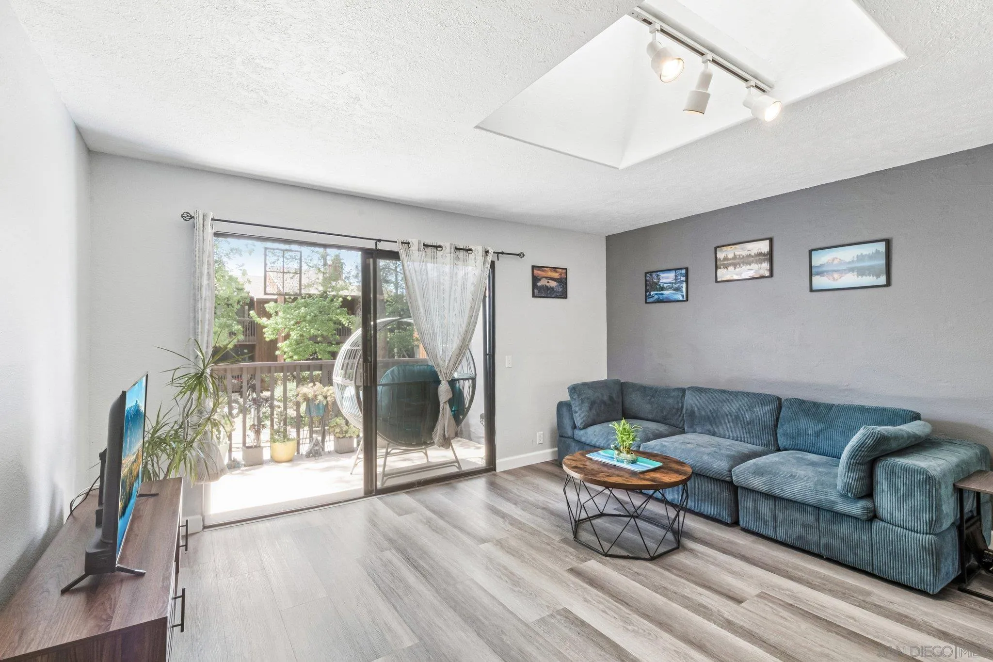 2157 Arnold Way, Unit 624 Alpine, CA 91901 - Photo 5 of 26 a living room with furniture and a floor to ceiling window