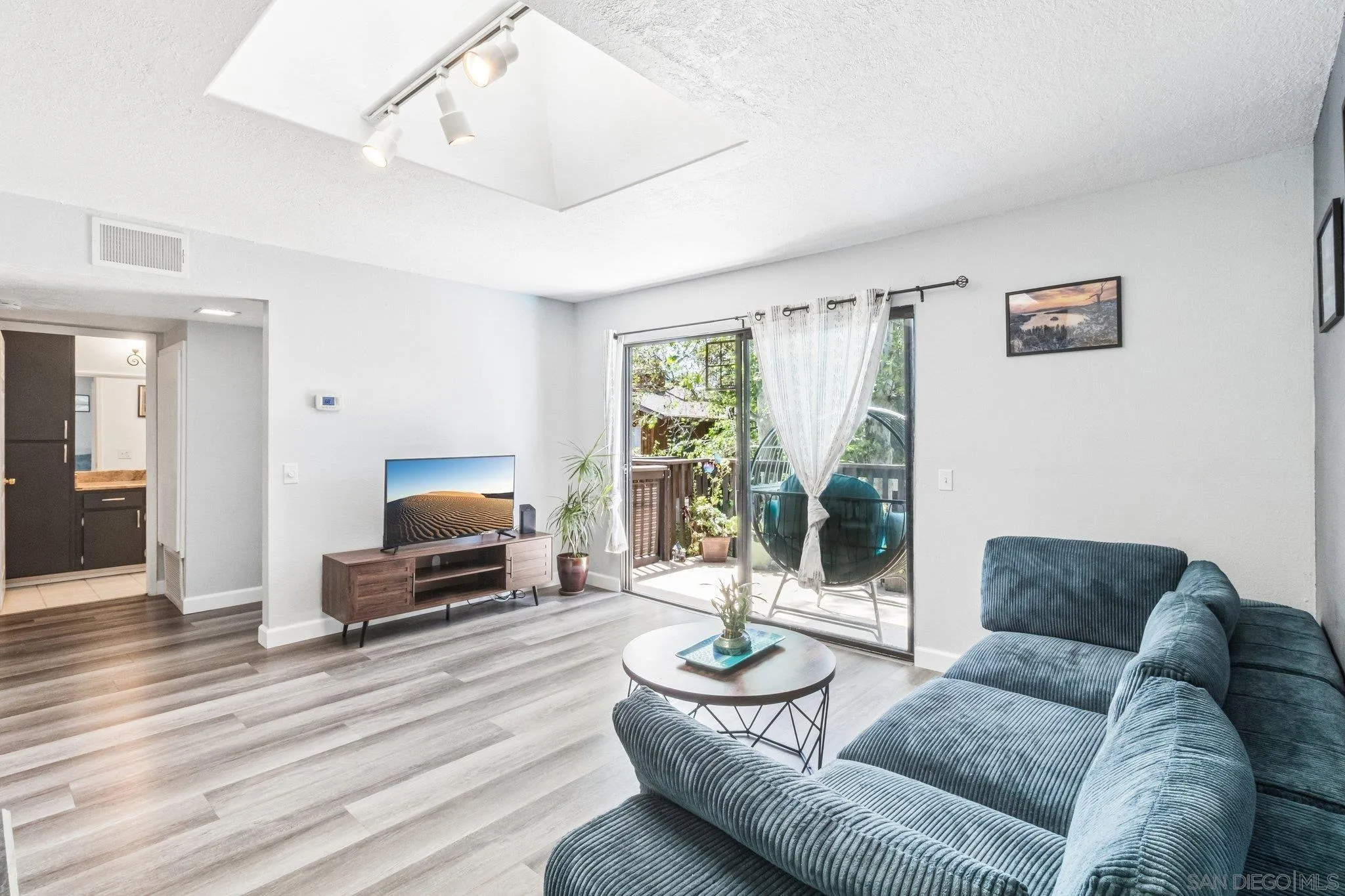 2157 Arnold Way, Unit 624 Alpine, CA 91901 - Photo 6 of 26 a living room with furniture and a flat screen tv
