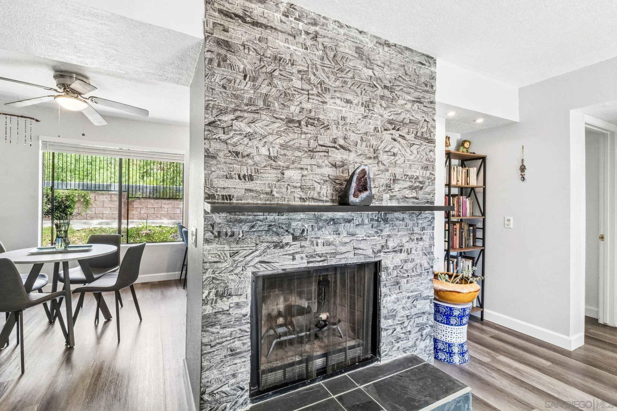 2157 Arnold Way, Unit 624 Alpine, CA 91901 - Photo 7 of 26 a living room with a fireplace and a floor to ceiling window