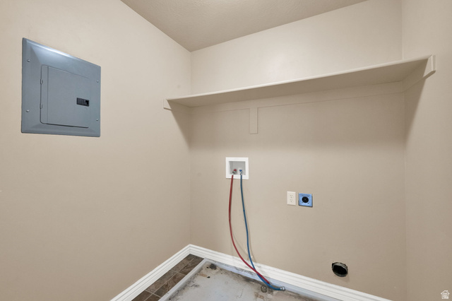 909 South Main Street, Unit G Layton, UT 84041 - Photo 19 of 25 Dedicated utility space featuring a built-in upper shelf, electrical panel, and connections for laundry appliances
