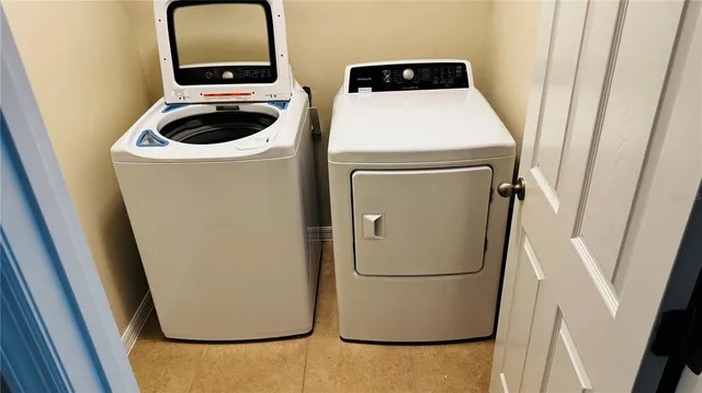 a utility room with dryer and washer