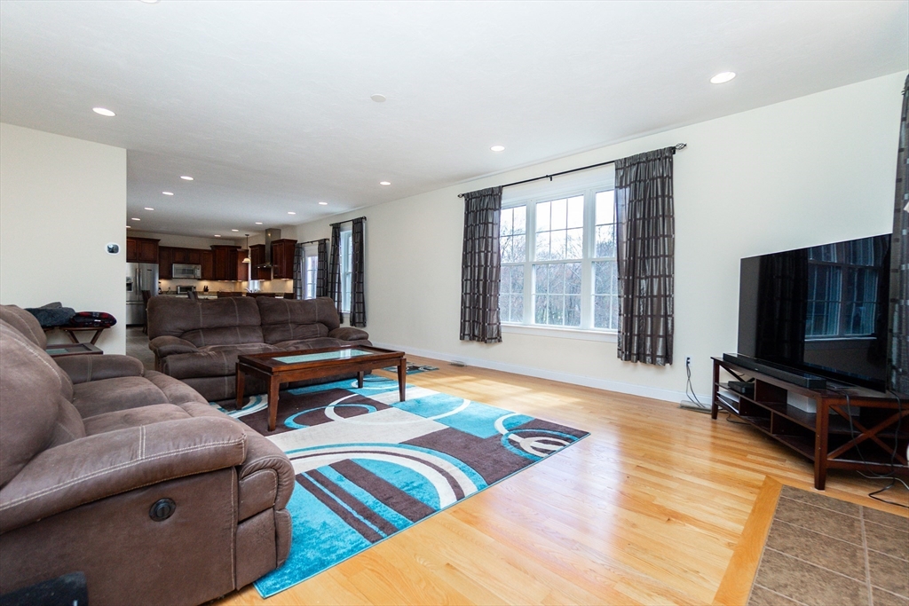 31 Whitehall Way Bellingham, MA 02019 - Photo 11 of 39 a living room with furniture and a flat screen tv