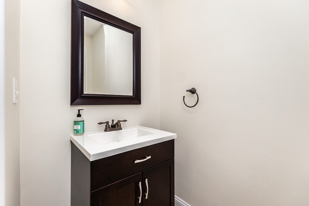 31 Whitehall Way Bellingham, MA 02019 - Photo 13 of 39 a bathroom with a sink and a mirror