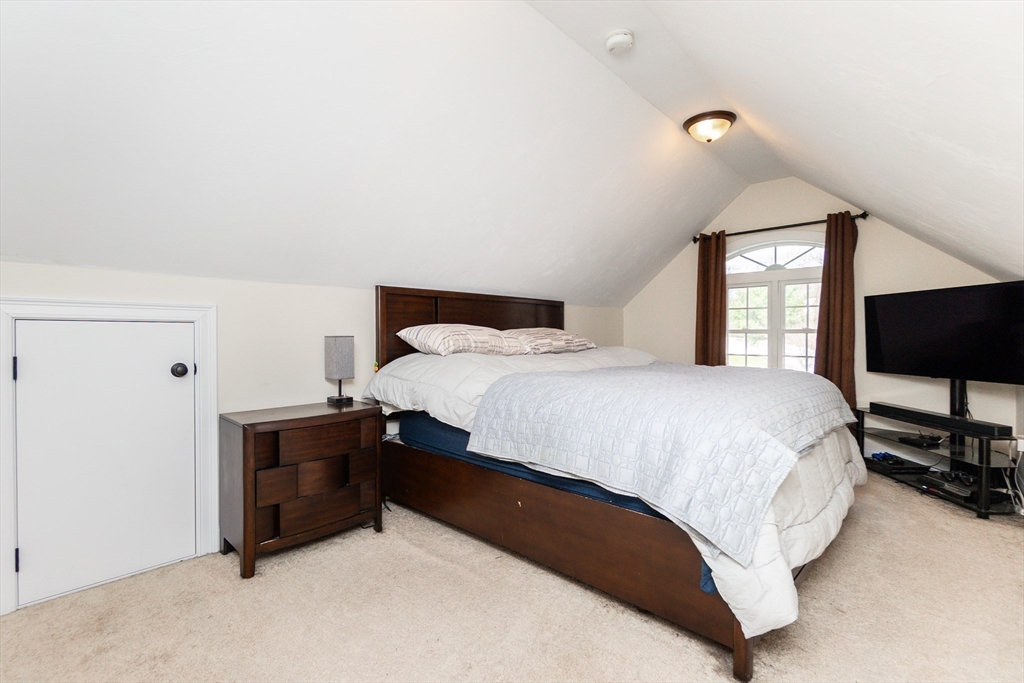 31 Whitehall Way Bellingham, MA 02019 - Photo 16 of 39 a bedroom with a bed and a flat screen tv