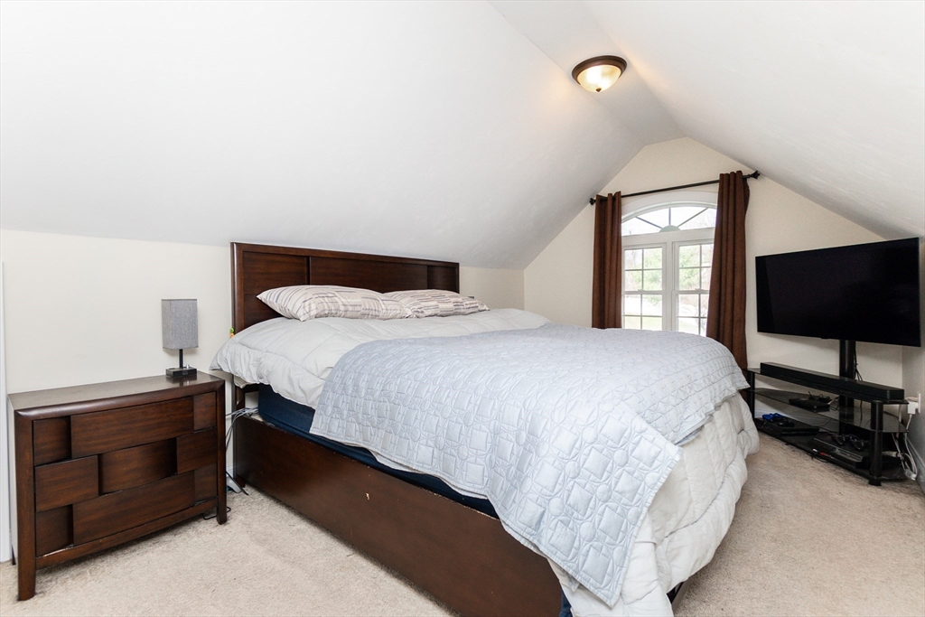 31 Whitehall Way Bellingham, MA 02019 - Photo 17 of 39 a bedroom with a bed and a flat screen tv