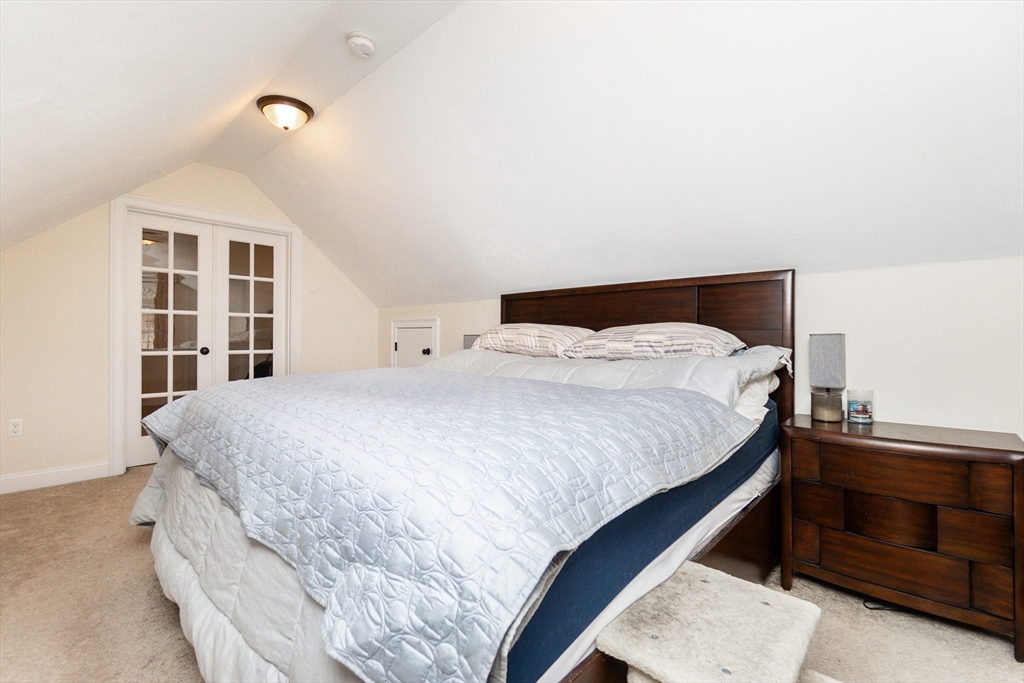 31 Whitehall Way Bellingham, MA 02019 - Photo 18 of 39 a bed sitting in a bedroom and chandelier