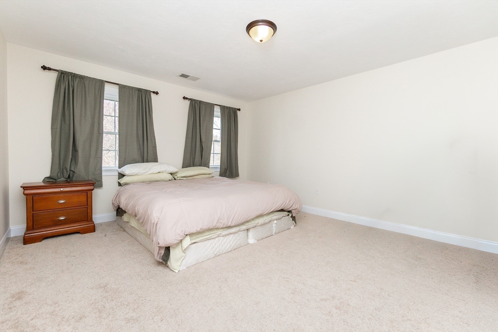31 Whitehall Way Bellingham, MA 02019 - Photo 29 of 39 a bedroom with a bed and a dresser