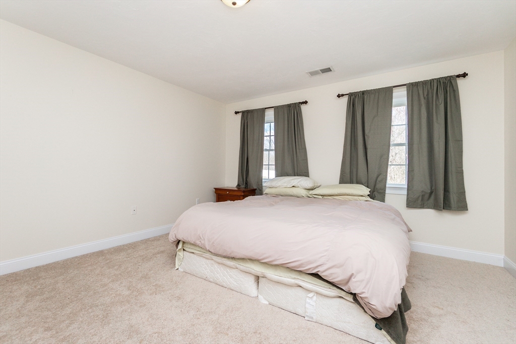 31 Whitehall Way Bellingham, MA 02019 - Photo 30 of 39 a bedroom with a bed and a window