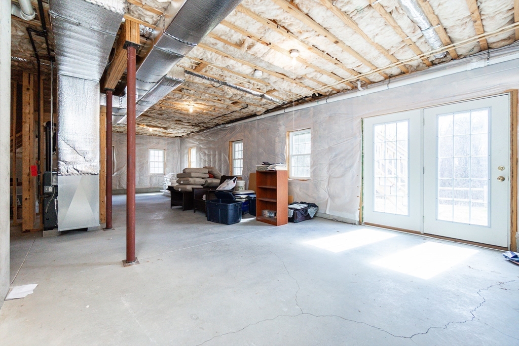 31 Whitehall Way Bellingham, MA 02019 - Photo 32 of 39 a view of a livingroom with furniture a ceiling fan and windows