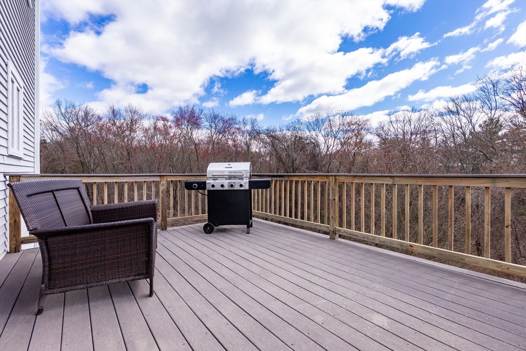 31 Whitehall Way Bellingham, MA 02019 - Photo 33 of 39 a view of a roof deck with wooden floor and fence