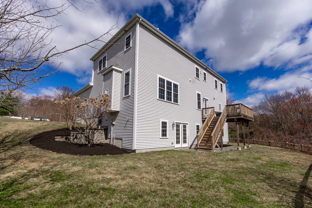 31 Whitehall Way Bellingham, MA 02019 - Photo 36 of 39 a view of a house with backyard and a tree
