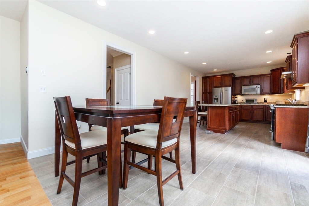 31 Whitehall Way Bellingham, MA 02019 - Photo 7 of 39 a dining area with furniture and kitchen view