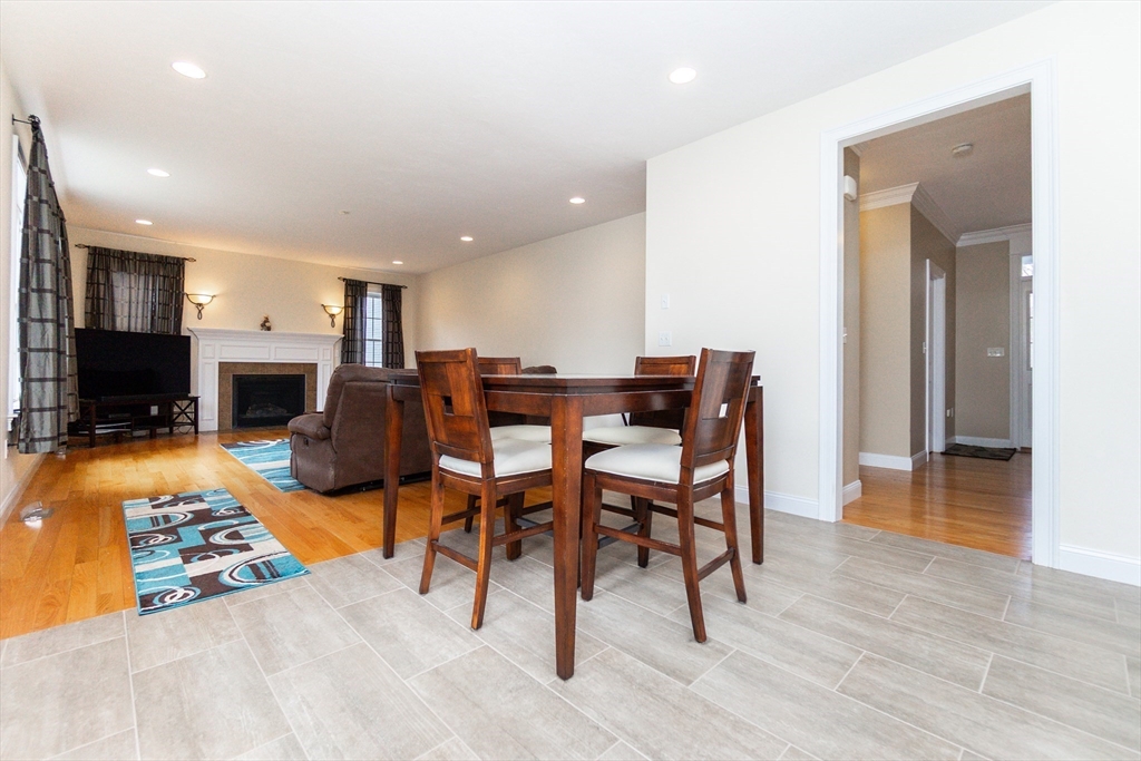 31 Whitehall Way Bellingham, MA 02019 - Photo 9 of 39 a view of a livingroom with furniture and a fireplace