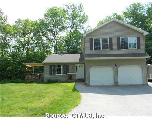 5 County Road Woodstock, CT 06281 - Photo 1 of 1 a front view of a house with a garden