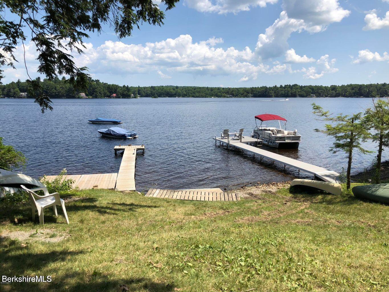 58 Stanley Road East Otis, MA 01029 - Photo 13 of 14 a view of a lake with a table and chairs