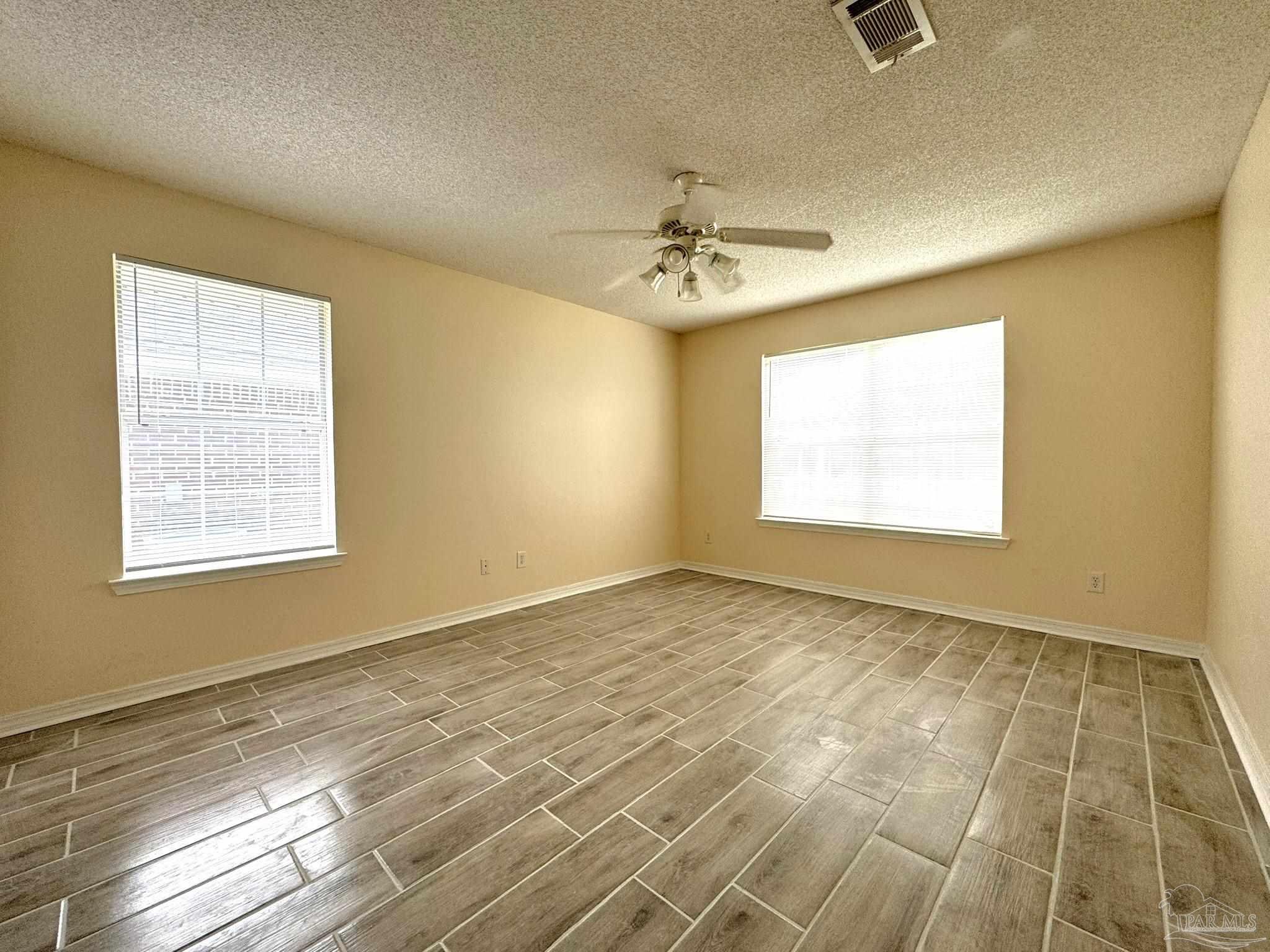 7972 Cayenne Way Pensacola, FL 32526 - Photo 4 of 11 a view of an empty room with a window
