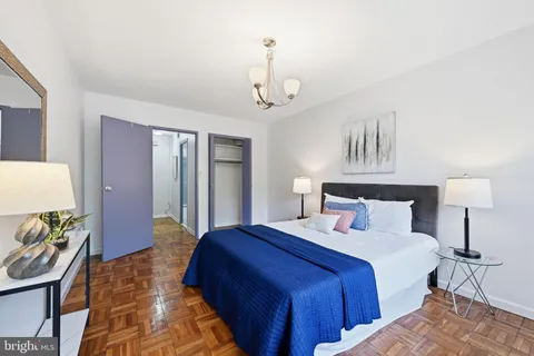 a bedroom with bed and a window