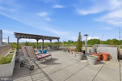 a view of a patio with couches chairs and a table and chairs