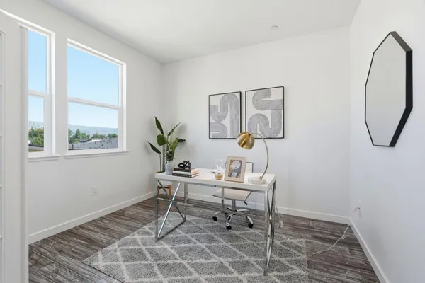 a reading room with furniture and a window