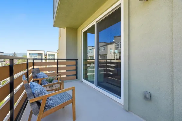 a view of a balcony with wooden floor