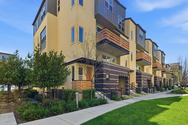 a view of a building with a yard