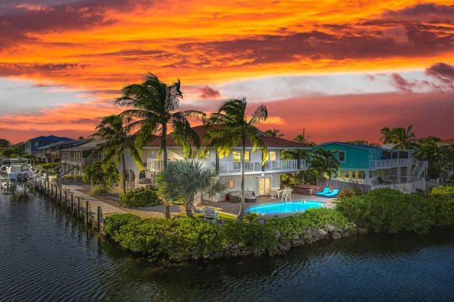 a view of a lake with a house in the background