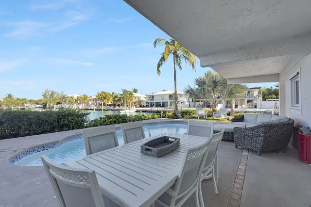 a view of a roof deck with furniture