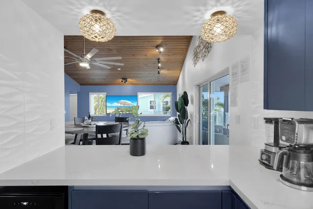 a view of a chairs and table in balcony
