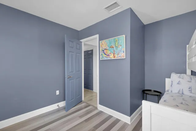 a bathroom with double sink and a mirror